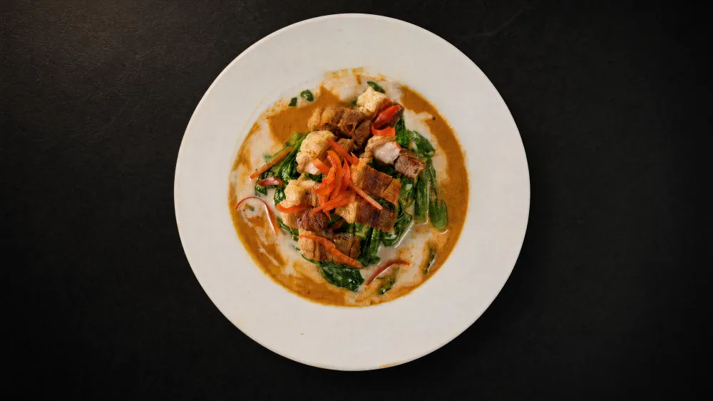 Thai Bistro Panang curry with crispy pork belly, green beans and red chili