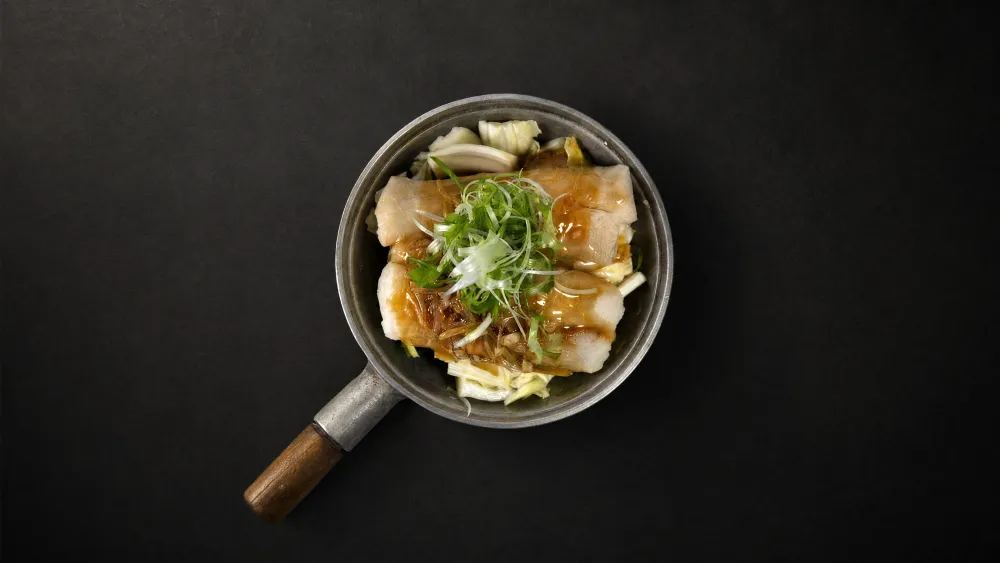Thai Bistro steamed rice noodle rolls with cabbage and scallion in savory sauce